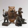 Black forest carvings four bears in various shapes and sizes 20th c largest 14 14
