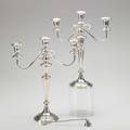 Pair of sterling silver candelabra weighted with 3 light configuration transformable to candlesticks 20th c together with a twist handled snuffer candelabra 15 12 x 14 14