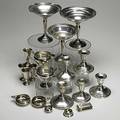 American sterling 20th c sixteen pieces five weighted low candlesticks three weighted footed compotes pair of gorham porringers four cordial cups alvin open salt baldwin and miller napkin ring