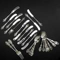 Unger brothers art nouveau sterling flatware twentyfive pieces loves dream 1 teaspoons 5 78 douvaine 12 butter spreaders 6 and 1 olive fork 6 14 la fantaisie 2 teaspoons 5