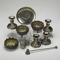 Collection of foreign silver eleven items four mexican silver candlesticks and snuffer three indopersian bowls french saucer in the japonesque manner two hanau vodka cup holders 276 ot