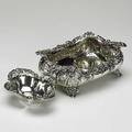 American sterling 19th20th c two pieces repouss rectangular footed bowl with rococo wave and shell pattern bordered with a lotus and floral pattern oval nut bowl with scroll and foliate border