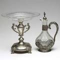 Continental silver mounted crystal ca 1900 two pieces wyler sterling mounted cruet with openwork handle and a young man figural stopper austrian 800 silver compote with wheel cut crystal bowl t
