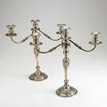 Pair of silver candelabra by frank m whiting  co 1930 three light on removable reed branch baluster column and flared foot with floral and garland repousse weighted column open foot some res