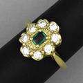 Emerald and diamond oval cluster ring emerald approx 40 ct tw surrounded by diamonds approx 50 ct tw in 18k yg 68 gs gw size 7