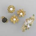 Three rings and a pair of ear clips ca 1960 pearl ear clips pearl ring size 7 quartz ring size 6 large 2 diamond and emerald ring size 8 all 14k yg 481 gs gw