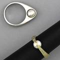 Contemporary sculpted pearl and diamond rings two rings one in 14k wg and the other in 14k yg each with a 6mm pearl and diamond accents 131 gs gw size 6 12