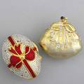 Judith leiber change purses two purses egg shaped with red bow hinged and gold colored purse shaped