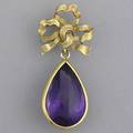Ribbon brooch with pearshaped amethyst ribbon brooch suspends buff top cut amethyst 25mm x 16mm in 14k yg 116 gs gw 2
