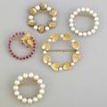 Circular pins mid 20th c five brooches ruby with floral motif 6mm pearls 4mm pearls gold hearts with 3mm pearls gold clamshells with 4mm pearls all 14k yg 266 gs gw largest 1 38