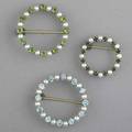 Pearl and gemstone circular brooches three brooches pearl and zircon pearl and emerald pearl and green garnet all 14k yg 185 gs gw largest 1 38