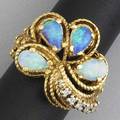 Opal and diamond ring four pearshaped opals and five small diamonds 10 ct tw in 18k yg 177 gs gw size 8