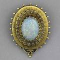 Victorian style opal and diamond pendantbrooch oval cabochon cut bluegreen opal approx 4 cts surrounded by diamond accents and 14k yg ornate design ca 1960 131 gs gw 1 38 x 1 18