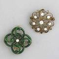 Gold pendantbrooches ca 1900 two brooches green enamel over 14k yg with 3mm pearl center by hedges 1 oec diamonds approx 1 cts tw in 14k rose gold 1 124 gs gw