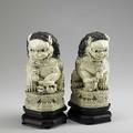 Pair of japanese ivory foo dogs carved on teak bases 20th c 10 with base