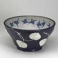 Japanese deep bowl dark blue with exterior lotus leaf decoration and flying storks on the interior early 20th c 10 x 18 12