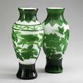 Pair of peking glass vases green cut to white parrot and leaf decoration 20th c 12 14