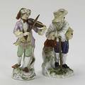 Meissen two porcelain figures one a violin player the other a traveler leaning on a walking stick 19th20th c taller 5 12