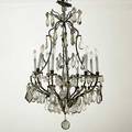Gilded wrought iron chandelier decorated with prisms and rosettes 20th c 36 x 24 dia
