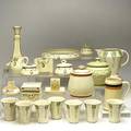 Roseville twentyone creamware pieces conventional cider set four pieces medallion green tint covered jar etc unmarked some damage pitcher 6 12 x 6 12 dia