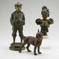 Metal statuary three pieces statue of a young boy and bust of a young lady both in spelter together with a cast iron bulldog doorstop all 19th20th c tallest 16 12