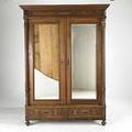 Victorian furniture oak twodoor armoire with later back asfound condition missing shelves hardware together with disassembled oak wardrobe parts with carved panels early 20th c hardware on