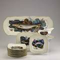 Limoges fourteen piece dinner service hand decorated in a fish motif includes rectangular platter 11 square plates and gravy boat with tray 20th c marked d  co platter 23 x 9 14