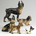 Cast iron dogs five painted pieces 19th20th c standing bulldog doorstop seated bulldog bulldog puppy schnauzer and cocker spaniel tallest 10
