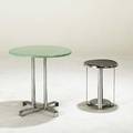 Wolfgang hoffman howell two occasional tables with chromed steel bases one with enameled wood top the other with laminate top smaller table has remnants of decal label taller 24 x 24 dia