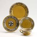 Saturday evening girls four pieces decorated in cuerda seca on yellow ground cup and saucer with swans 2 landscape plates by fanny levine one with canada goose made for james storrow all marked