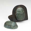Grueby two scarab paperweights blue green glaze one mounted in hammered copper bookend unmounted stamped grueby faience and paper label scarabs 4 x 2 34 bookend 5 x 4 12
