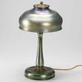 Louis comfort tiffany favrile glass table lamp with candlestick base and dome shade reglued crack to shade signed lc tiffany favrile 18 x 10 12