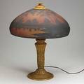 Arts  crafts table lamp with patinated white metal base and domed shaped glass shade reversepainted with a landscape unmarked 22 12 x 18 dia
