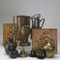 Arts  crafts style metal group includes art nouveau silver washed coffee pot copper pitcher and vase wmf style brass asian pieces and two carved wood tiles tallest 12