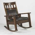 Stickley bros rocking armchair with dropin leather seat and tacked on back unmarked 38 x 31 x 38