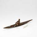 Inuit kayaks one in ivory signed joe kunnuk the other in leather 20th c longer 18