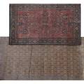 Two oriental area rugs one with red background and blue border the other with rose floral design 20th c larger 54 x 83