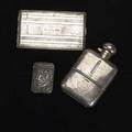 Three silver accessories blackinton match safe depicts head of pan with surreal women and horse heads silver cased glass flask sheffield 1906 machined cigarette case by elgin american 1212 ot gw
