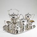 Dominick  haff silver tea and coffee service ca 1930 six pieces and a similar shreve  co covered sugar bowl on associated silverplated copper tray everted pear shapes on ring foot kettle on sta