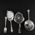 Ornate silver serving pieces by tiffany  co or gorham ca 18801900 tiffany florentine 9 saratoga chip server and 6 34 fork elaborate gorham openwork angel handled bonbon server 9 gorham 