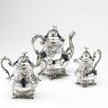 H salisbury  co coin silver coffee service new york 18301838 three pearshaped pieces scroll feet with grape vine motifs swan spout and flower finials monogrammed 10 14 coffee pot 8 12