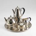 Georg jensen silver and ebony coffee and tea service designed by johan rohde spothammered bulbous forms half reeded with ball finials and fluted ebony handles 9 12 coffee pot 45a 6 tea pot 4
