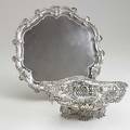 English silver holloware elkington  co silver salver with shell and scroll edge on three bracket feet 13 ca 1892 oval reticulated footed bowl by henry matthews birmingham 1886 the bottom ins