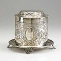 Atkin bros sterling biscuit barrel sheffield 1877 cylindrical body and hinged dome lid with profuse fruited garland and branch decorations vacant reserves integral plate on scroll feet 263 ot