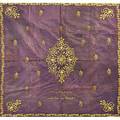 European silk torah table cover ca 1900 gilt embroidered arabesque ornaments and border on purple ground cream silk obverse hebraic familial inscription worn and soiled 67 x 61 12