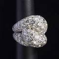 Diamond platinum ring ca 1940 bombe form designed as entwined loops circular brilliant cut bead set diamonds approx 12 cts tw 237 gs size 7 resized unmarked note from the estate of gloria