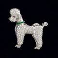 Felix vollman diamond and platinum poodle brooch new york ca second half of the 20th century designed in half relief with approx 223 cts tw pave fine brilliant cut diamonds calibre emerald coll