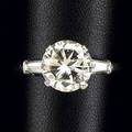 Diamond and platinum solitaire ring round brilliant cut diamond 335 cts by formula flanked by tapered baguette cut diamonds 40 ct tw size 8 12