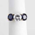 Diamond and sapphire threestone ring fine brilliant cut diamond 157 cts and two faceted circular cut sapphires 220 cts tw in 14k yg and wg size 5 34
