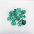 Fifteen unmounted gem emeralds oval and spherical cabochons approx 618 cts tw largest 15mm x 12mm note unmounted gemstones from the estate of harry b roth 19132008 a longtime member of the